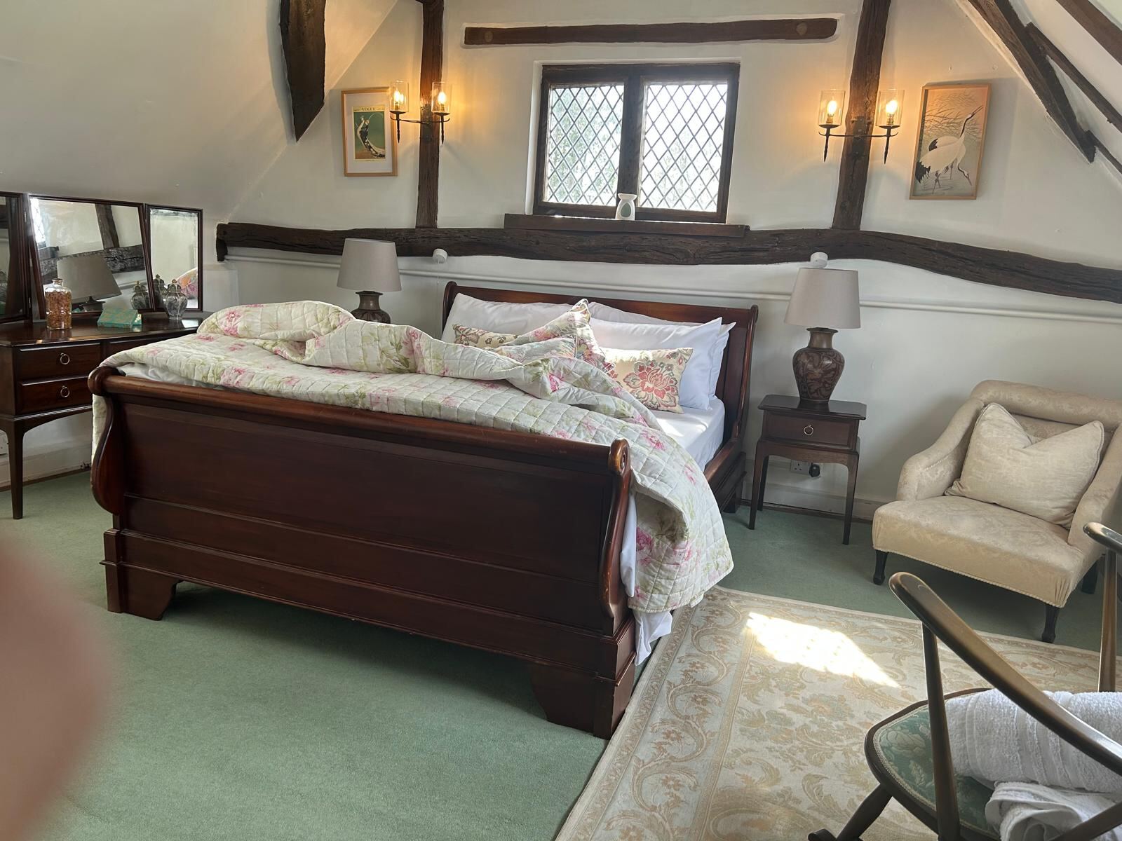Beamed bedroom with antique furniture