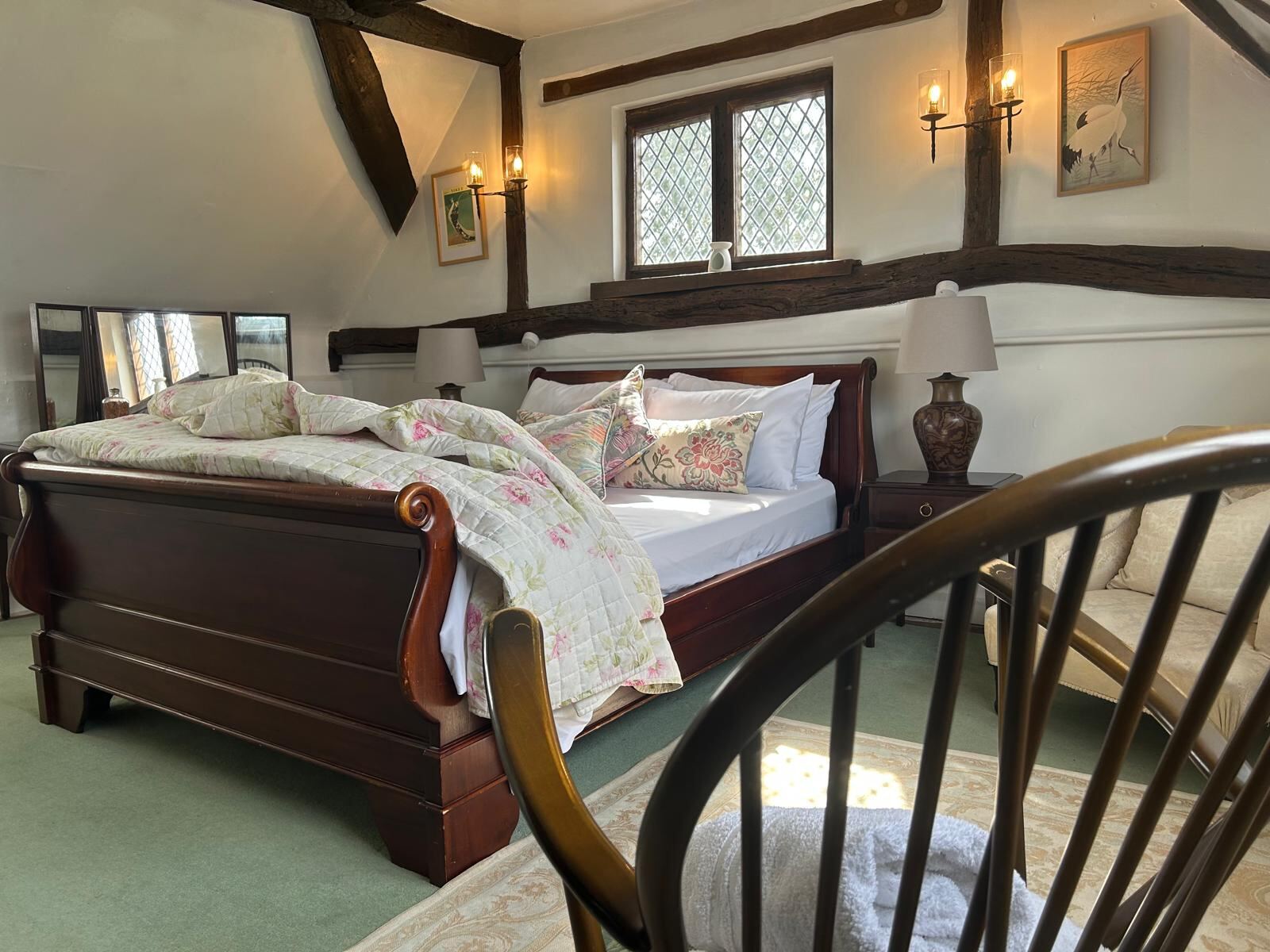 Bedroom with sleigh bed and Japanese crane prints