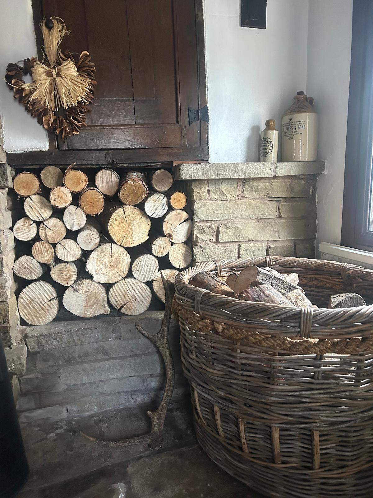 The log store and wicker basket by the hearth