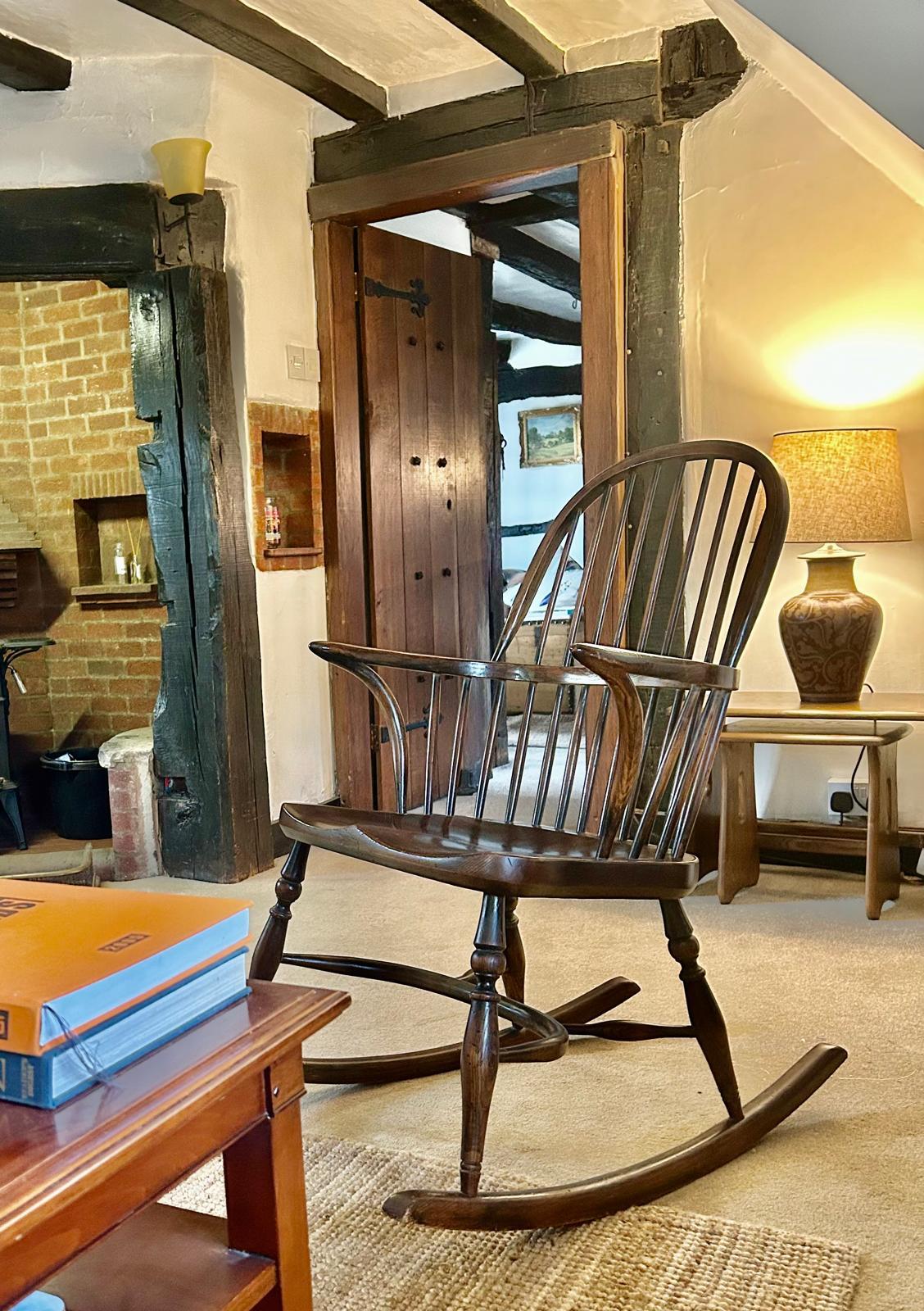 Antique Windsor rocking chair beside the inglenook