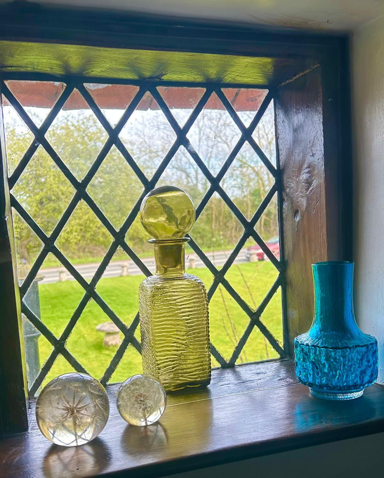 Coloured glass on a windowsill