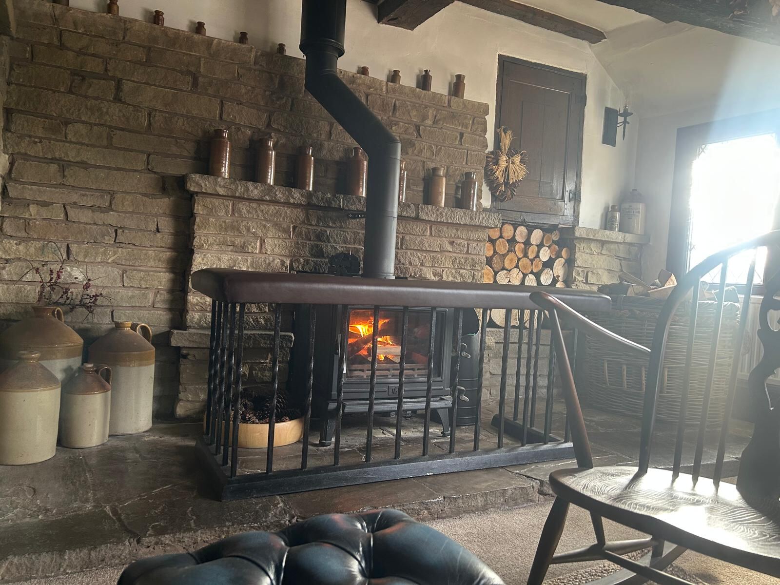 The wood burner and stoneware bottles